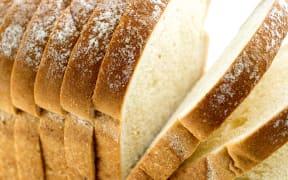 Closeup macro of loaf of bread with slices.

Bread loaf sliced generic