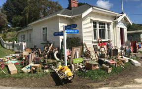 Flood-damaged items on the street in Tinui.
