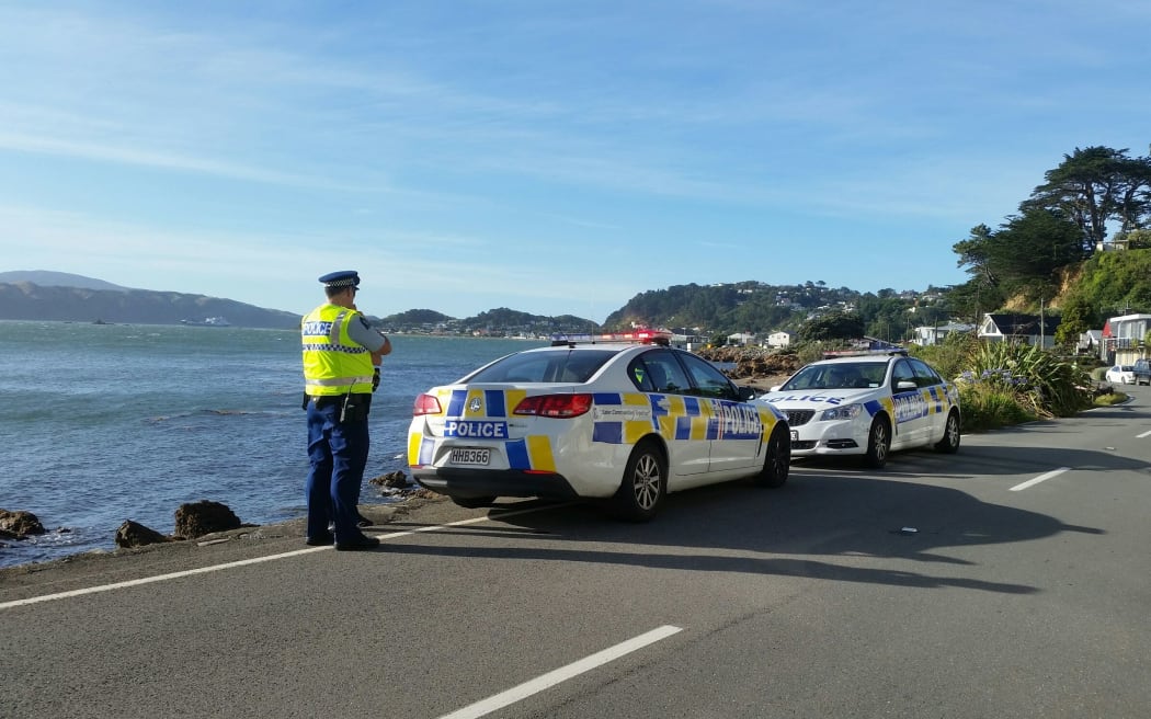 Police at Karaka Bay where a body was found on Saturday.
