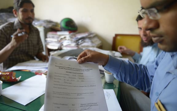 Polio vaccination certificates are prepared at a hospital in Rawalpindi.