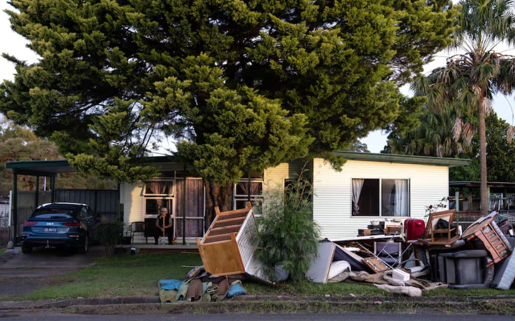 Michael Wicks watched on as his family had to tear apart his flood-damaged home.