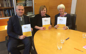 Minister for Energy and Resources Megan Woods (centre) with the first phase of the Electricity Price Review.
NZ First MP Fletcher Tabuteau (left) and chair of the review panel Miriam Dean QC) on her right.