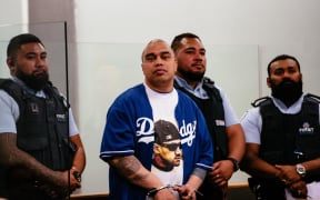Convicted killer Siuaki Lisiate at Auckland High Court to hear about being jailed for his attack on notorious killer Graeme Burton inside prison.