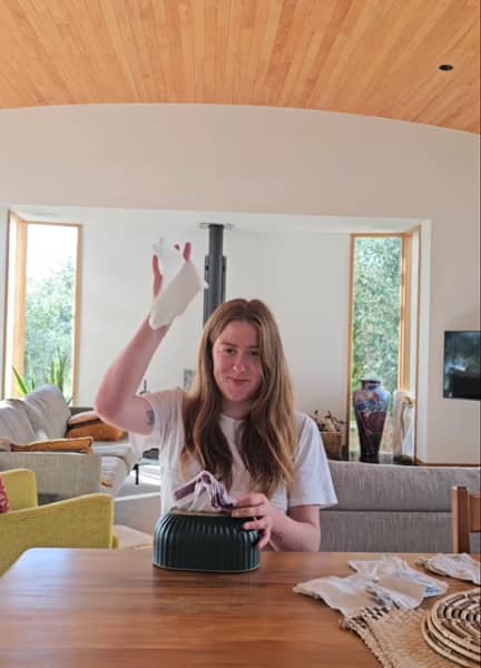 Ethically Kate founder Kate Hall takes out a hanky from her box of tissues that's storing handkerchiefs instead.