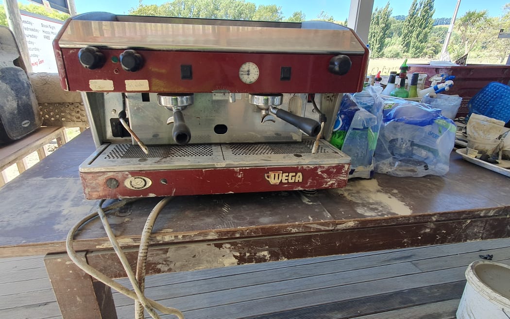 Floodwaters reached almost to the bartop, and this coffee machine , in Tīnui pub, near the cost in Wairarapa.