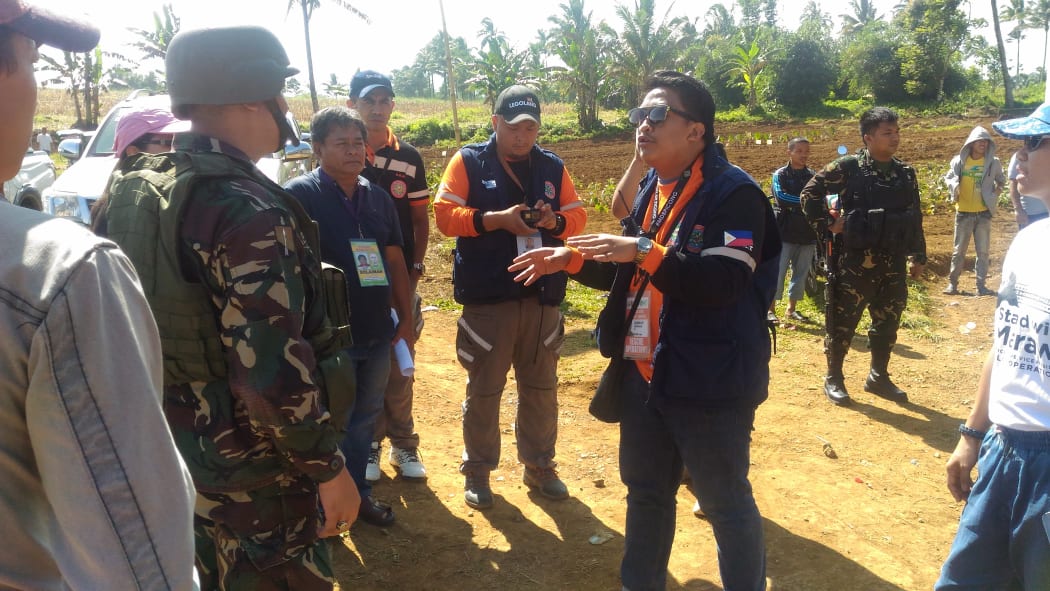 Abubakar (right) during a community program in one of the Evacuation Centers.