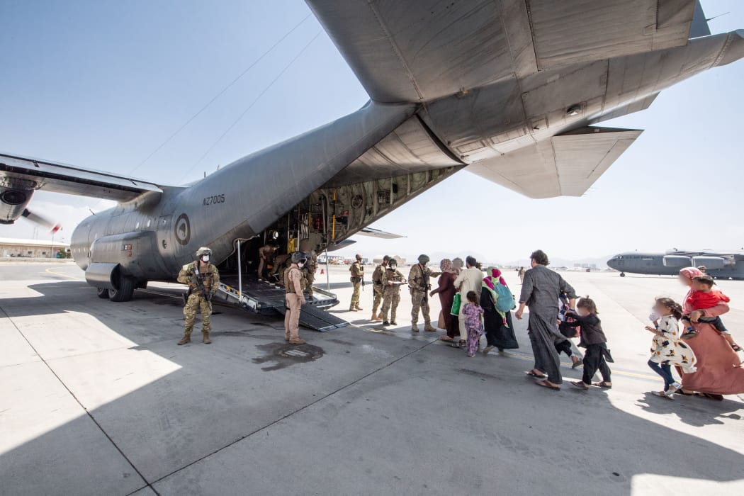 People boarding the Hercules C-130 at Hamid Karzai International Airport.