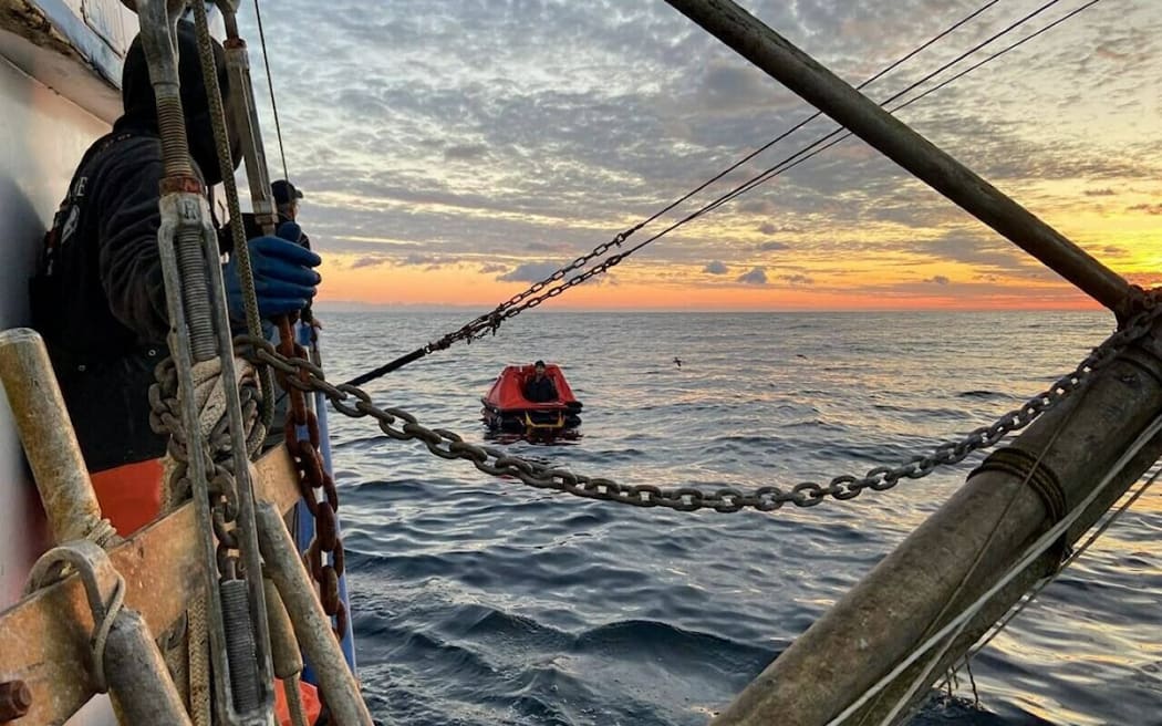 The Coast Guard shared an image of the sailors rescuing the missing fisherman.