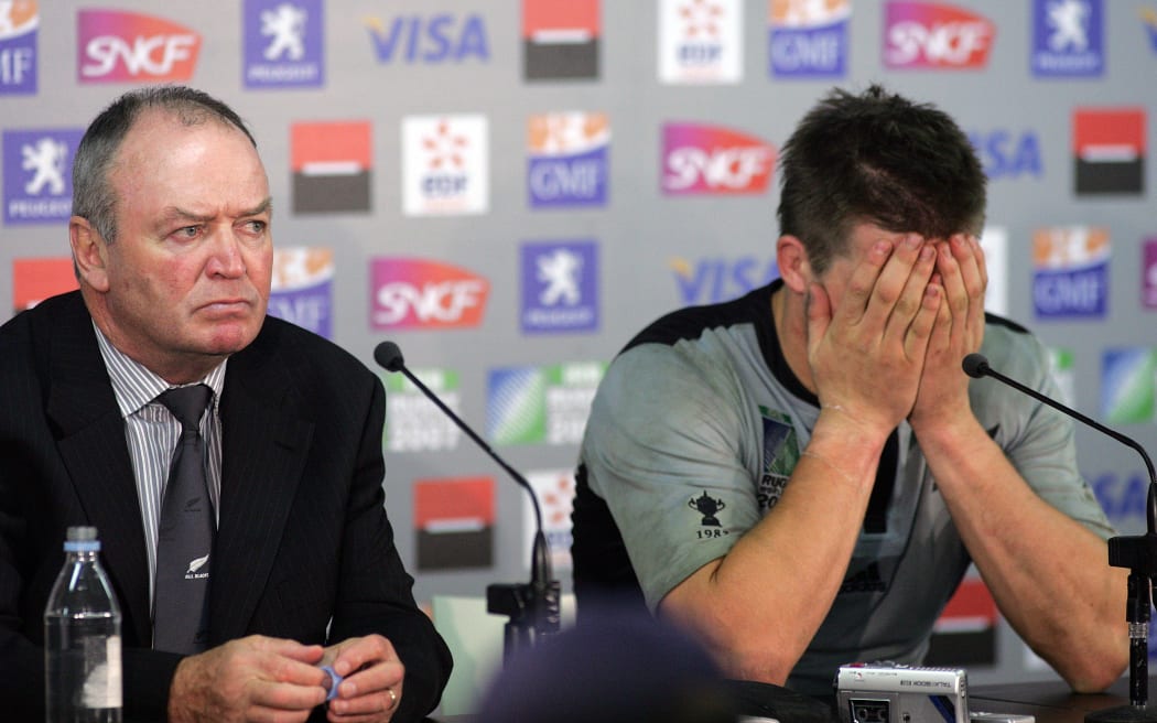 All Black coach Graham Henry and a dejected All Blacks captain Richie McCaw attends the post match press conference following their Quarter Final loss to France in Cardiff.