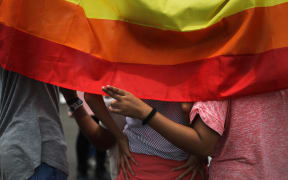Rainbow flag during a women's day rally in Jakarta, on March 4, 2017, as part of March 8 International women's day celebrations. Everyone of all gender, culture, religion and race is welcome to join this exciting march that aims to unite and celebrate women throughout Indonesia through music, poetry, culture, and the arts.  (Photo by Afriadi Hikmal/NurPhoto) (Photo by Afriadi Hikmal / NurPhoto / NurPhoto via AFP)