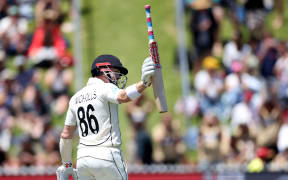 New Zealand's batsman Henry Nicholls celebrates reaching his 150 runs on the second day of the second cricket Test match between New Zealand and the West Indies at the Basin Reserve in Wellington on December 12, 2020. (Photo by Marty MELVILLE / AFP)