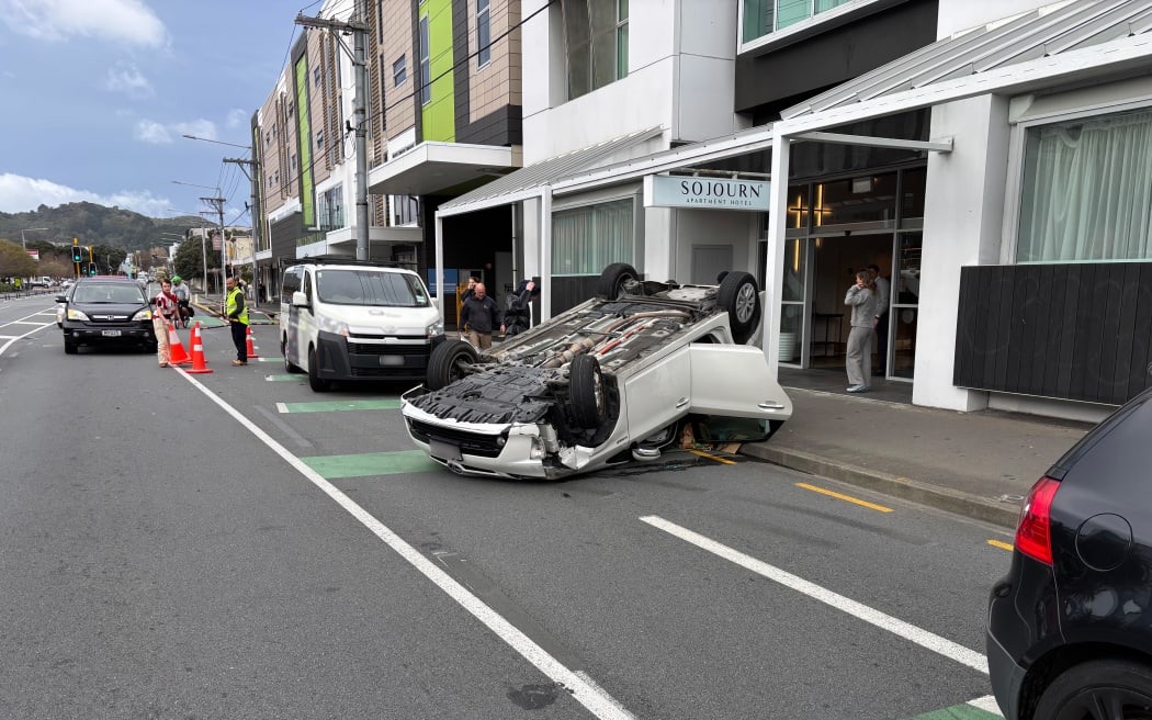 A Toyota Prius on its roof after a crash with a VW Golf outside Wellington Hospital.