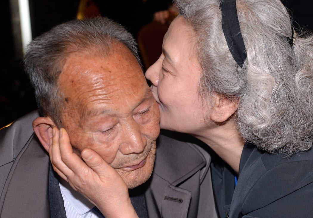 South Korean Lee Jeong-Suk, right, 68, kisses her North Korean father Ri Heung-Jong, left, 88, during a separated family reunion meeting.