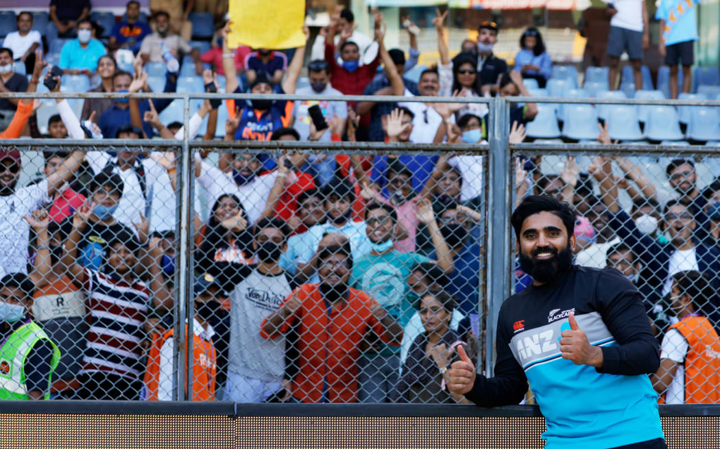Ajaz Patel of New Zealand interacting with family members and fans during the test at Wankhede Stadium in Mumbai in 2021.