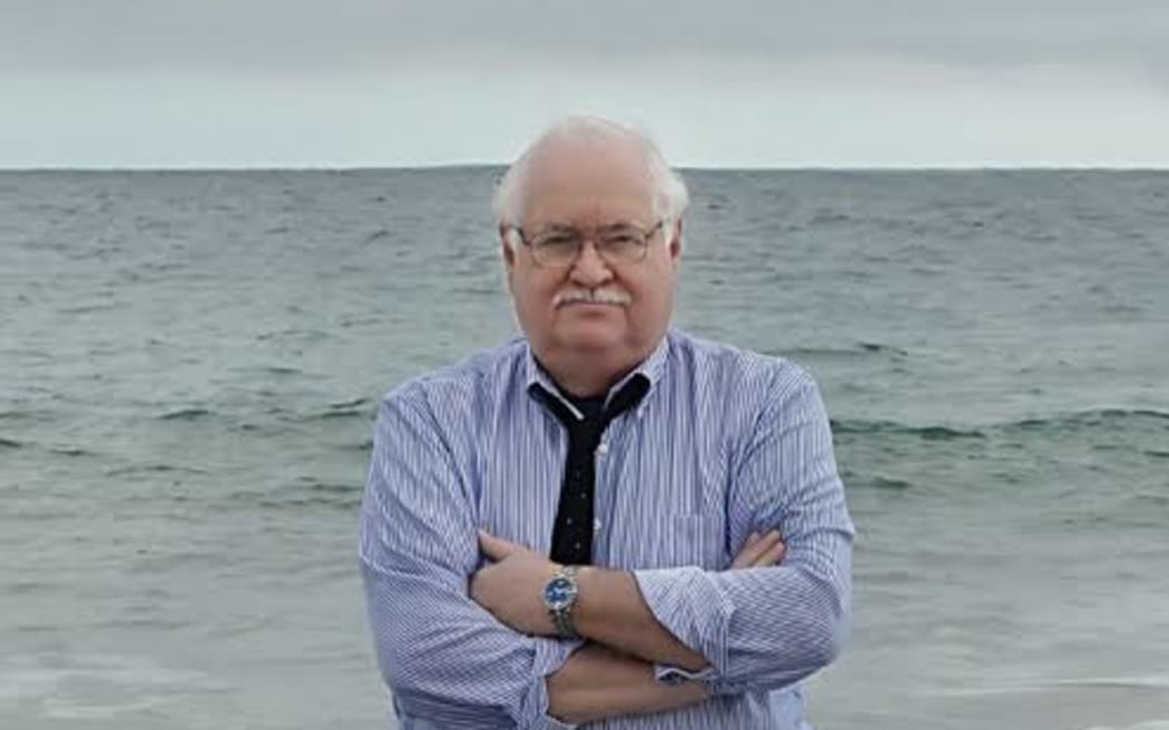 Carl Gottlieb (JAWS screenwriter) standing in the ocean.