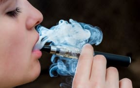 Closeup detail of Female with an Electronic Cigarette, Horizontal shot