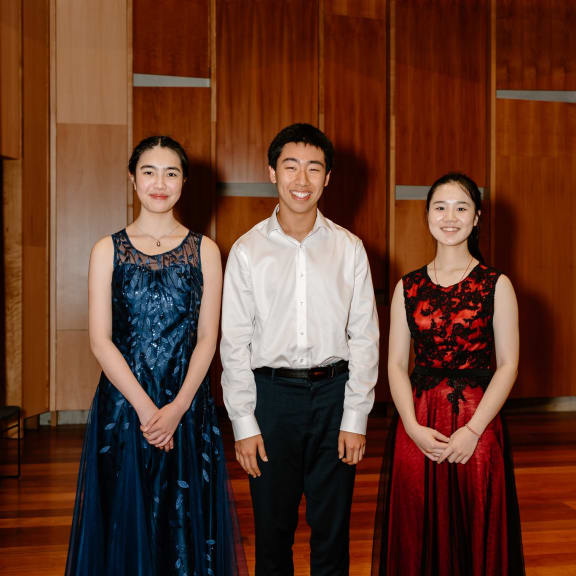 The three young pianists who are the finalists in the National Concerto Competition 2023,  Madeleine Xiao, Henry Meng, and Yuzhang Wu (all from Auckland).