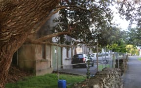 The hall's east side is just metres away from the footpath