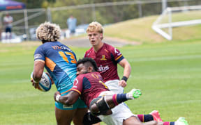 Highlanders Timoci Tavatavanawai tackles his opposite, Moana Pasifika's Fine Inise at North Harbour Stadium on Friday in a pre-season Super Rugby Pacific clash. The Highlangers won 26-21. Photo: Highlanders