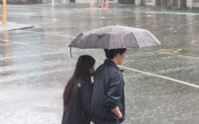Heavy rain falling in Auckland city.