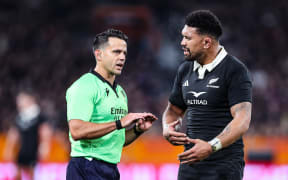 Ardie Savea discusses a try that was later disallowed with referee Nic Berry.