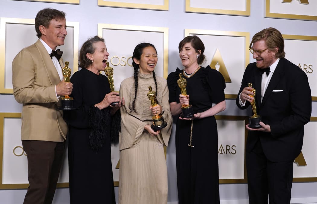 Producers Peter Spears, Frances McDormand, Chloe Zhao, Mollye Asher and Dan Janvey, winners of the award for best picture for Nomadland.