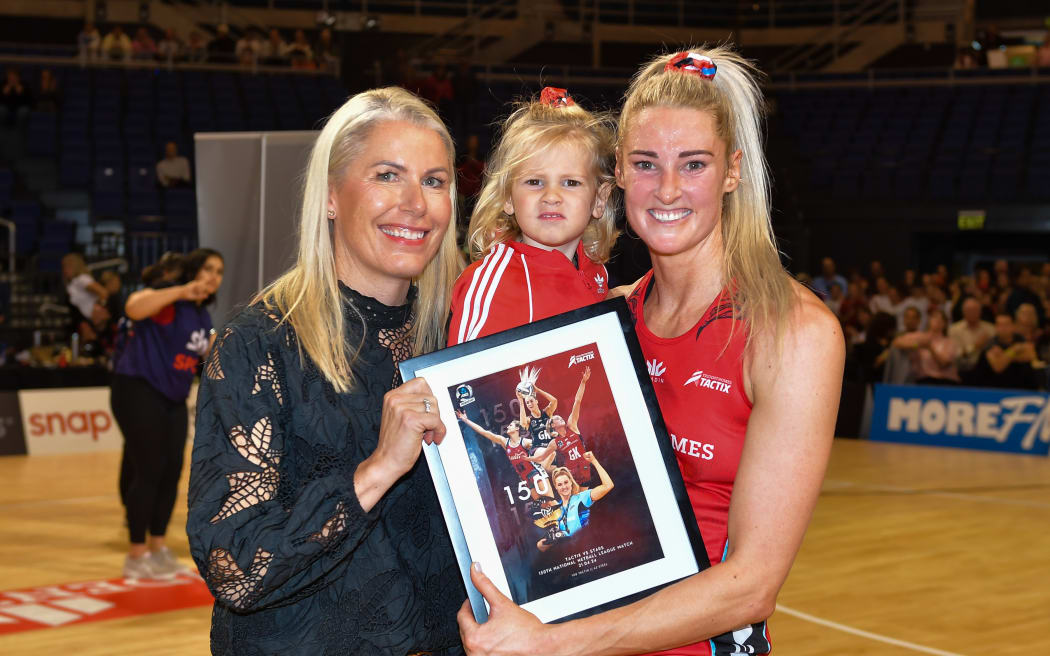 Jane Watson (R) of the Tactix celebrates playing 150 ANZ premiership netball matches, alongside coach Marianne Delaney-Hoshek (L).