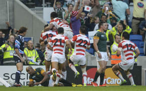 Japan celebrate victory over the Springboks during the 2015 Rugby World Cup.