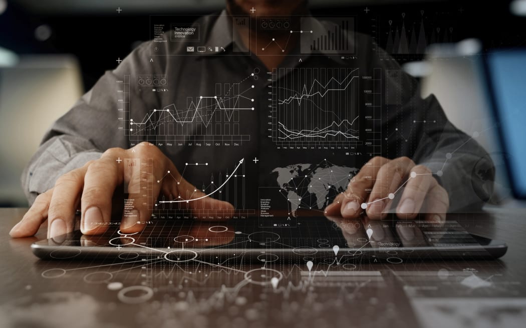 business man hand working on laptop computer with digital layer business strategy and social media diagram on wooden desk