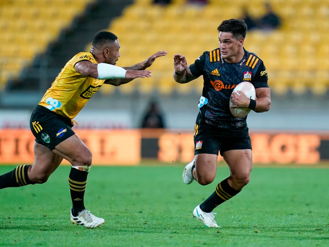 Hurricanes Ngani Laumape and Chiefs Quinn Tupaea.
