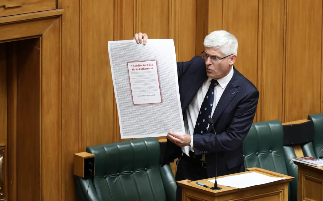 National MP Tim McIndoe has brought visual aids. This one is a full page advert by doctors opposed to the End of Life Choice Bill.