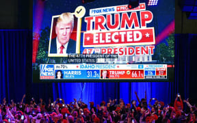 Supporters of former US President and Republican presidential candidate Donald Trump celebrate as Fox News declares him the next President of the United States during an election night event at the West Palm Beach Convention Center in West Palm Beach, Florida, early on 6 November, 2024.