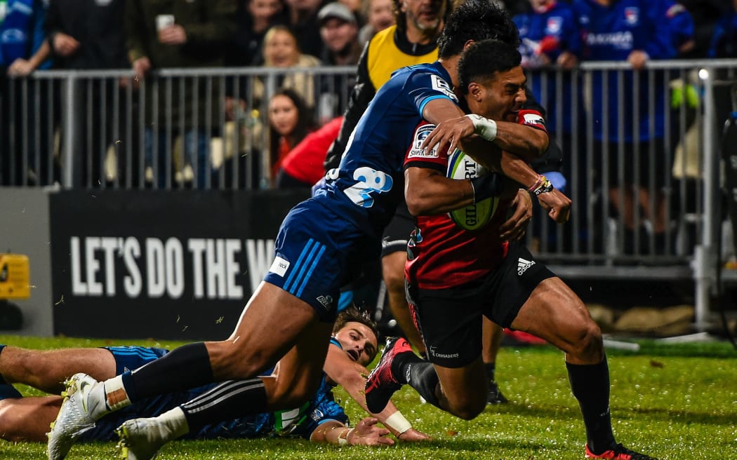Richie Mo'unga of the Crusadersis tackled by Melani Nanai of the Blues to stop a try during the Super Rugby match, Crusaders V Blues at Christchurch Stadium, Christchurch, New Zealand, 25th May 2019.Copyright photo: John Davidson / www.photosport.nz