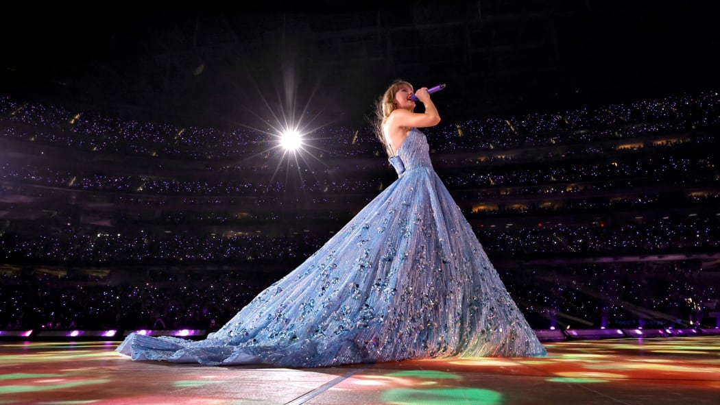 Taylor Swift on stage in the concert movie Taylor Swift: The Eras Tour