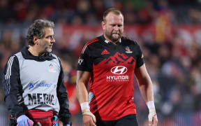Joe Moody leaves the field with an injury.