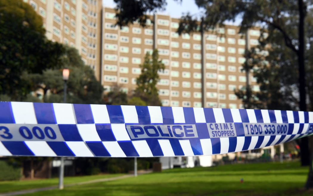 Police tape blocks an entrance at a public housing estate which is undergoing a forced lockdown in Melbourne on July 10, 2020, as the city records another 288 new cases in a fresh outbreak of the COVID-19 coronavirus. Australia will slash the number of returning citizens allowed into the country by half as it struggles to contain an outbreak of coronavirus in its second-largest city, officials announced on July 10. (Photo by William WEST / AFP)