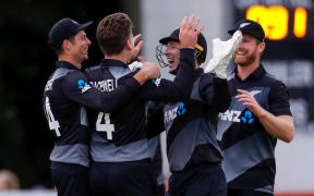 New Zealand's Michael Bracewell celebrates with teammates.