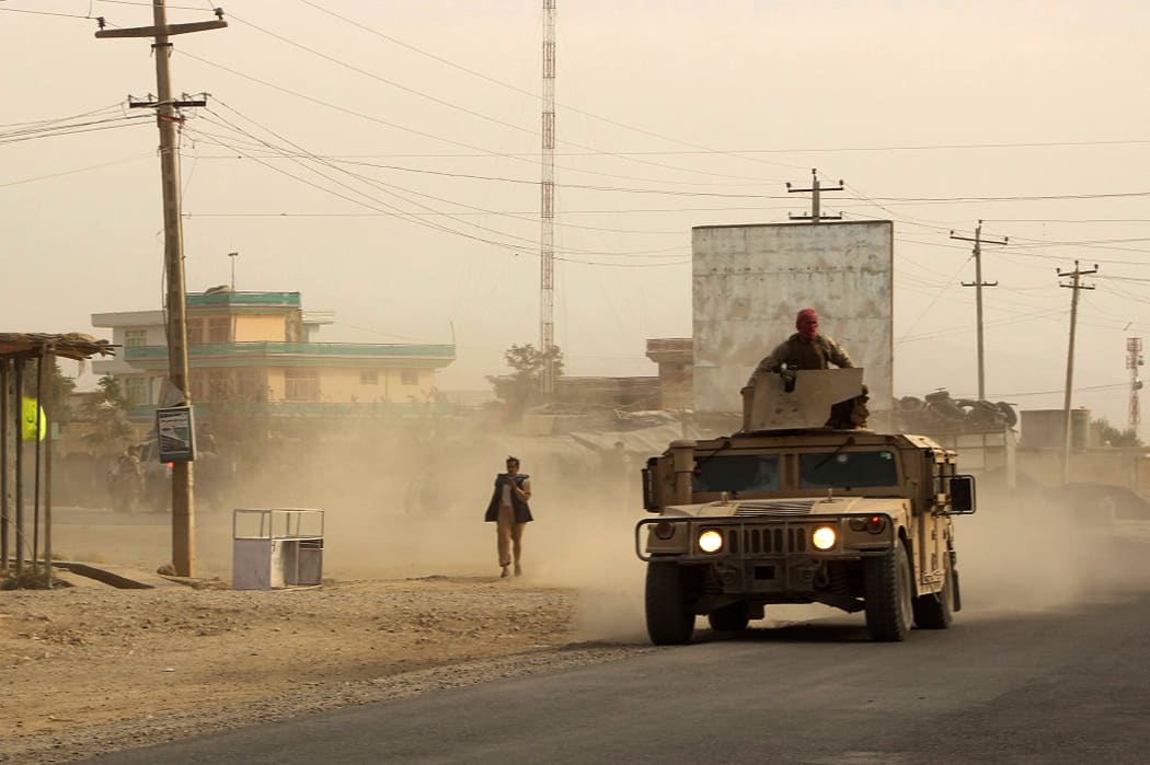 Afghan security forces - who have been engaged in ongoing fighting with Taliban fighters - travel in a Humvee in Kunduz on 28 September 2015.