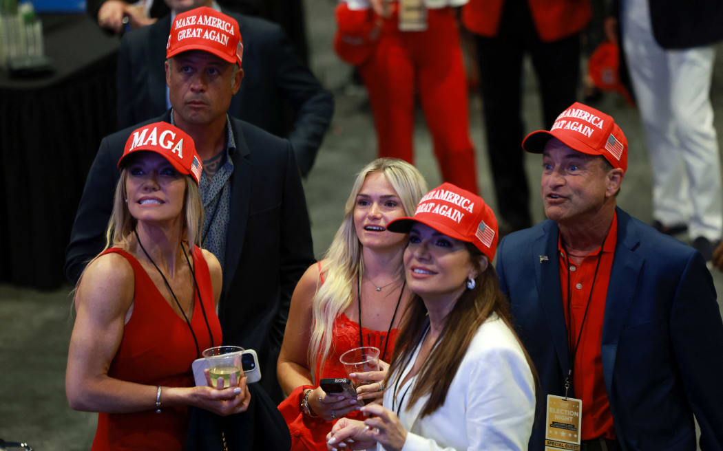 WEST PALM BEACH, FLORIDA - NOVEMBER 05: Supporters react as Florida is called for Republican presidential nominee, former U.S. President Donald Trump during an election night event at the Palm Beach Convention Center on November 05, 2024 in West Palm Beach, Florida. Americans cast their ballots today in the presidential race between Republican nominee former President Donald Trump and Vice President Kamala Harris, as well as multiple state elections that will determine the balance of power in Congress.   Joe Raedle/Getty Images/AFP (Photo by JOE RAEDLE / GETTY IMAGES NORTH AMERICA / Getty Images via AFP)