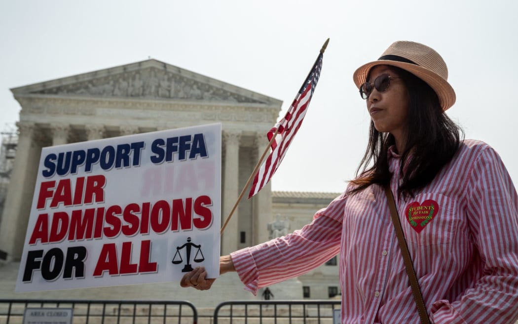 Min Chen of the DC chapter of the Asian America Political Action Committee celebrates theUS Supreme Court ruling that universities may not consider race in admissions, effectively ending affirmative action.