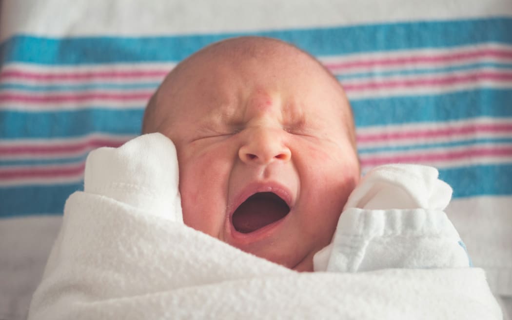 Newborn baby yawns