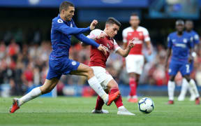 Charly Musonda Jr of Chelsea puts pressure on Lucas Torreira of Arsenal.