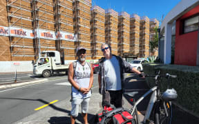 William Fremlin and local writer Russell Brown standing in front of the Kainga Ora apartment at the corner of Great North Road and Point Chevalier Road, that's due for completion in June this year.