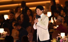South African comedian and host Trevor Noah speaks during the 66th Annual Grammy Awards at the Crypto.com Arena in Los Angeles on February 4, 2024.
