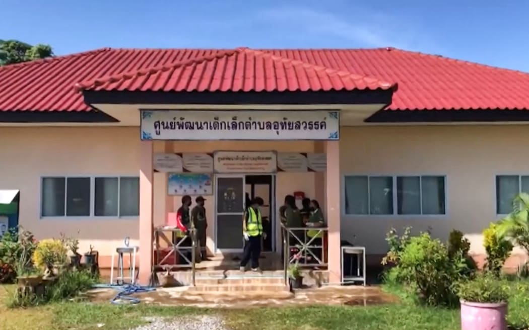This frame grab from video footage by Thai PBS, made available via AFPTV and taken on October 6, 2022, shows the exterior of a nursery in the northern Thai province of Nong Bua Lam Phu, where a former policeman went on a mass shooting.