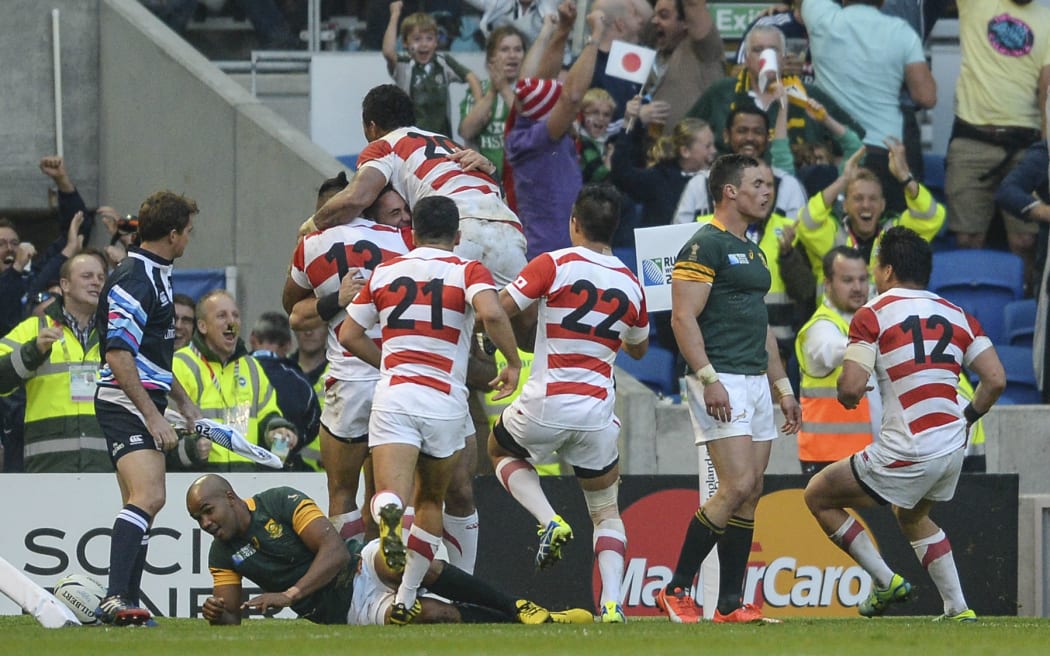 Japan celebrate victory over the Springboks during the 2015 Rugby World Cup.