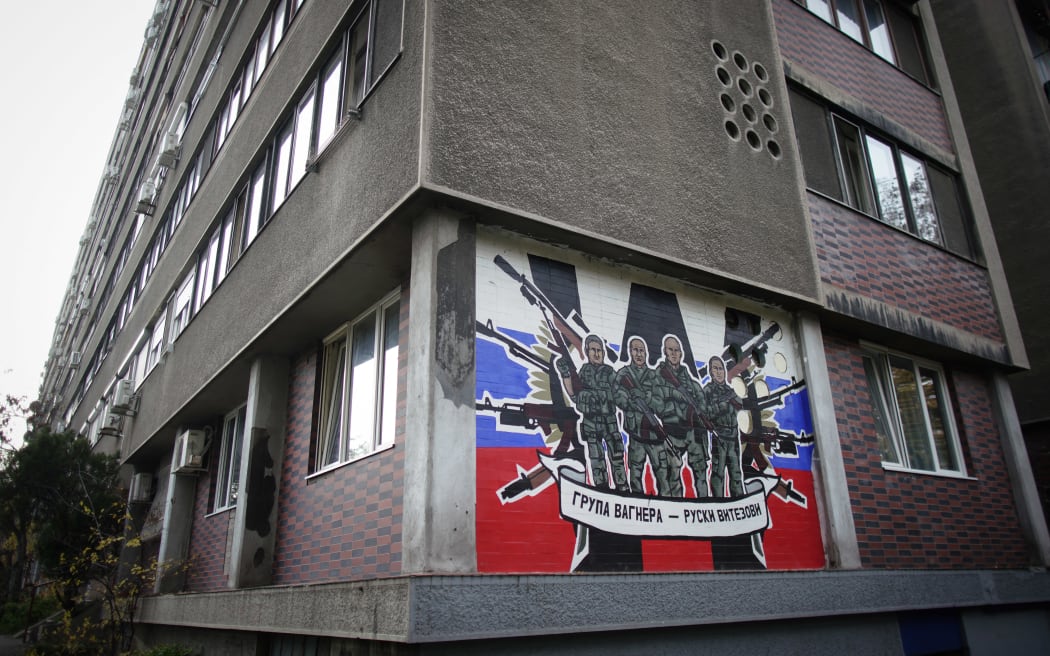A mural depicting Russia's para military mercenaries 'Wagner Group' reading : "Wagner Group - Russian knights" on a building's wall in Belgrade, on November 17, 2022.