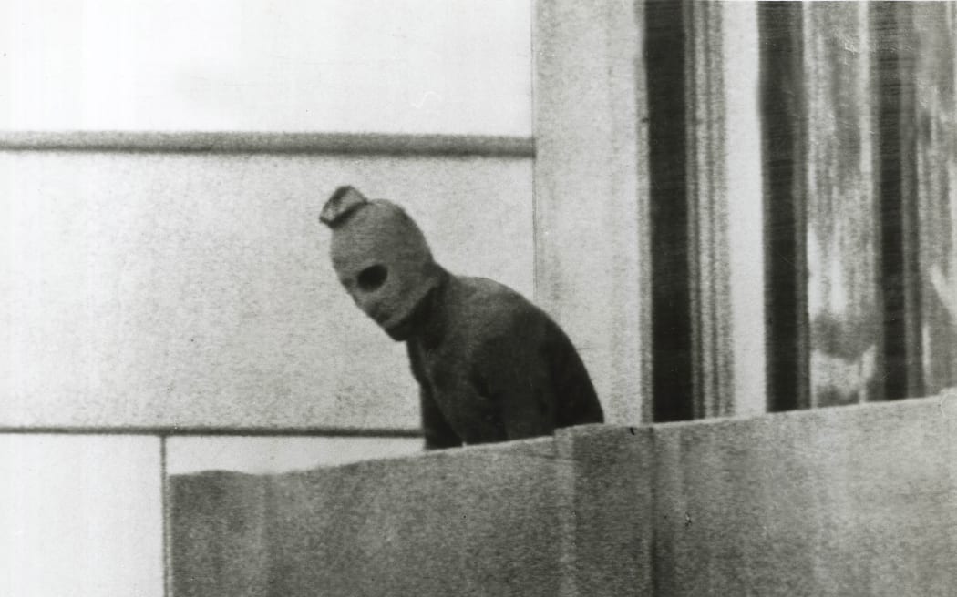 A Fairfax photographer captured one of the defining images of the Munich Olympics in 1972. This Palestinian is one of a group that had taken 12 Israeli athletes hostage.