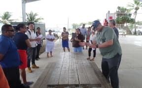 Marshall Islands Director of Public Health Dr. Frank Underwood, right, leads an exercise with health staff preparing for their response to community spread of Covid in the future.