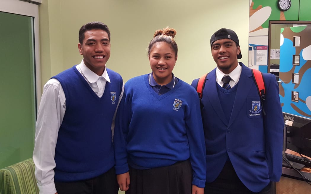 Tangaroa College students Lisi Tuifua, Carterina Kareroa Tusini and Lino Abraham at the book launch of 'Samoan Heroes'.